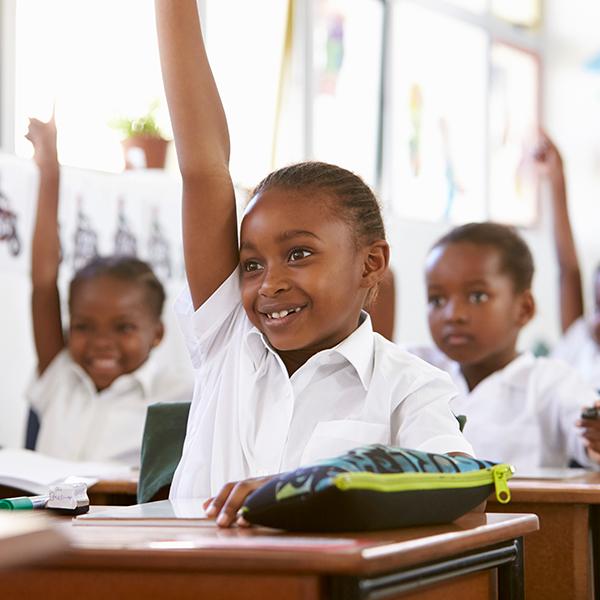 Image of smiling children in a classroom