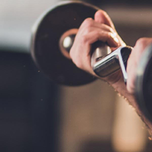 man lifting barebell weights